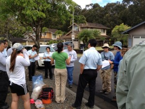Multi-agency crew assembled for instructions.